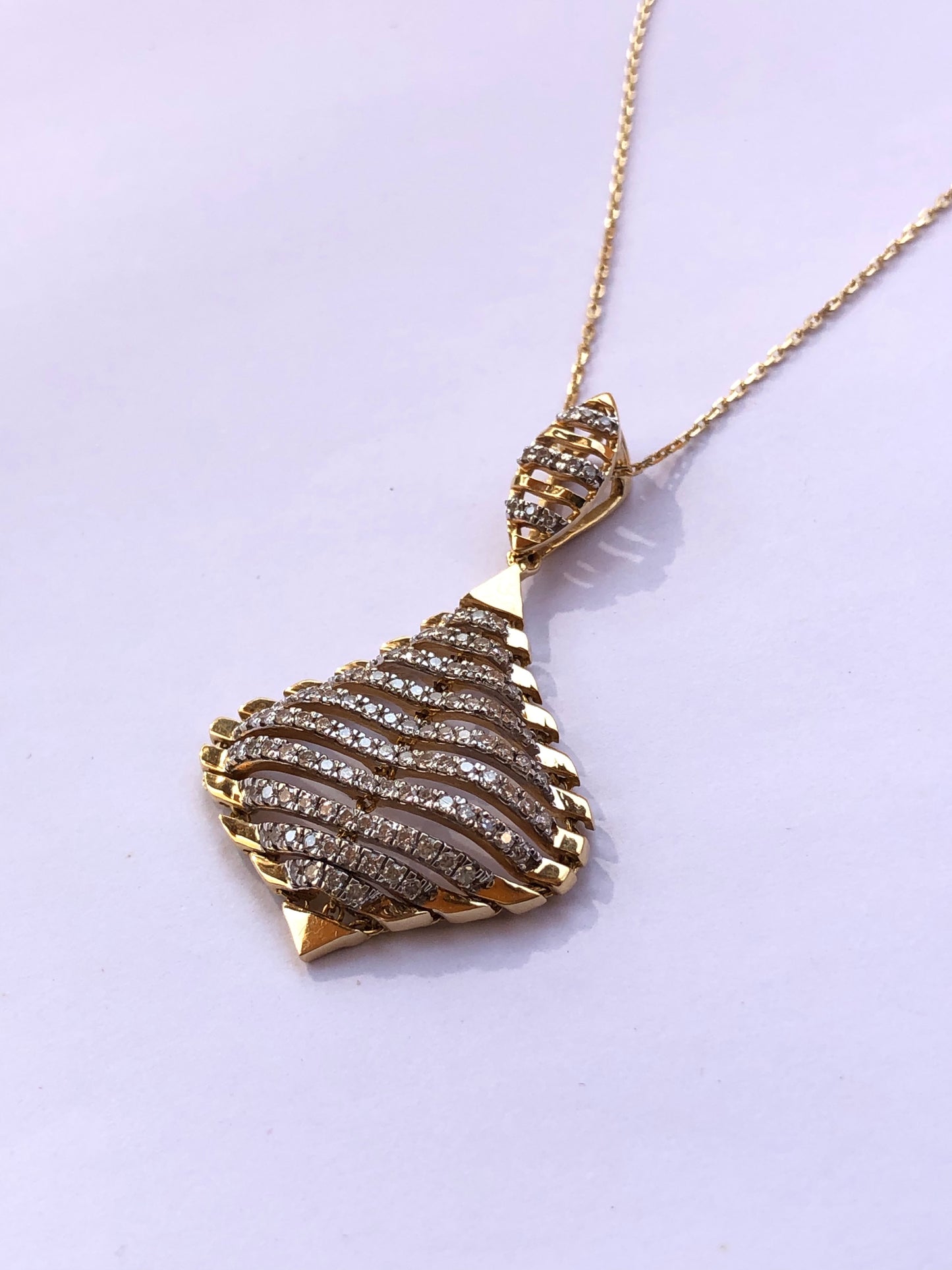 18kt Gold & Diamond pendant by Damas UAE.